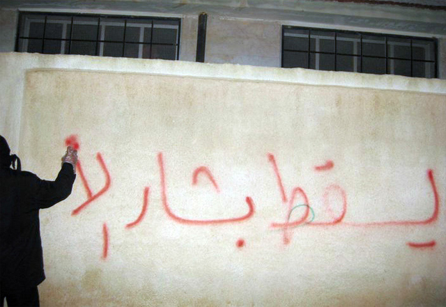 Graffiti in Syria reading “Down with Bashar al-A[ssad]”