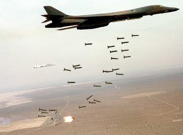 A B-1B Lancer unleashes cluster munitions. The B-1B uses radar and inertial navigation equipment enabling aircrews to globally navigate, update mission profiles and target coordinates in-flight, and precision bomb without the need for ground-based navigation aids