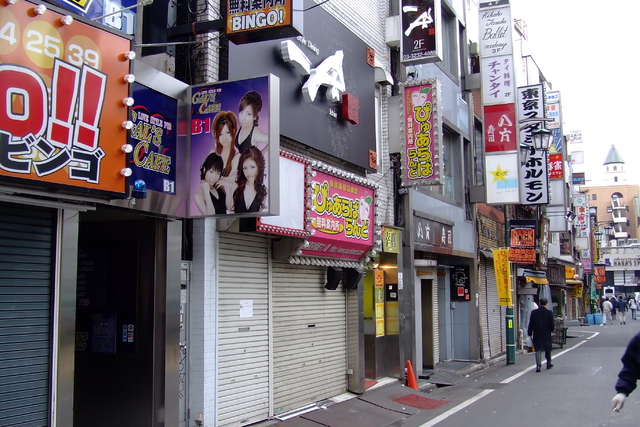 Signboards promote sex-related services at a red light district in Shinjuku, Tokyo.