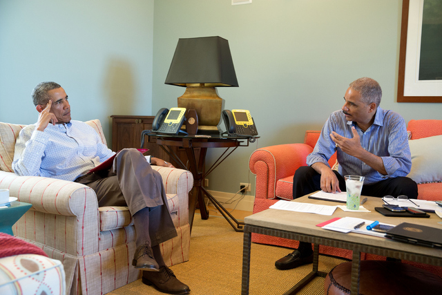 Attorney General Eric Holder with President Obama in the wake of the shooting incident in Ferguson, MO