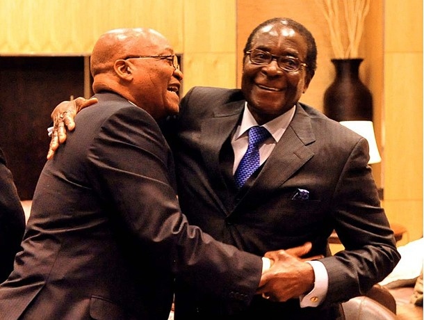 South African President Zuma embraces Zimbabwean President Mugabe at a Zanu-PF conference.